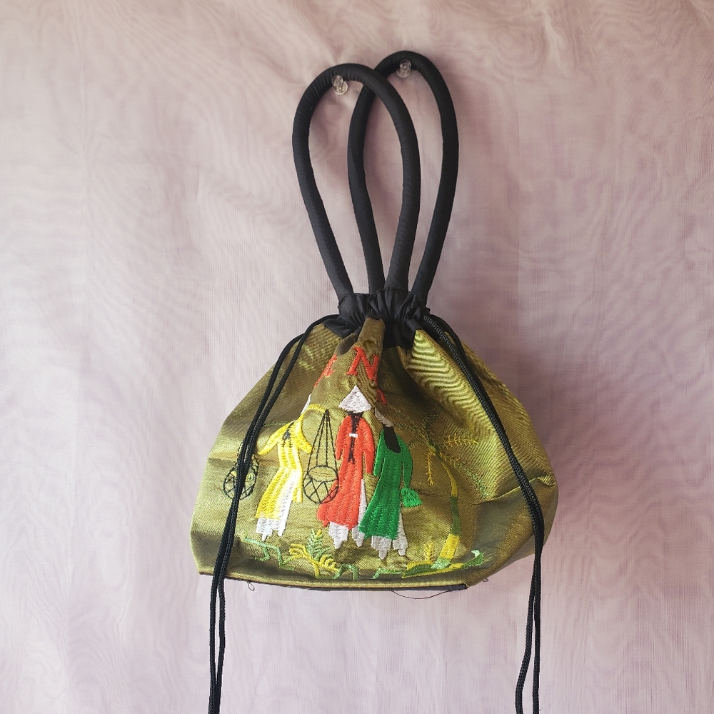 Purse. Green with black accents.